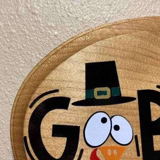 Gobble 'til you wobble, wood sign, close up