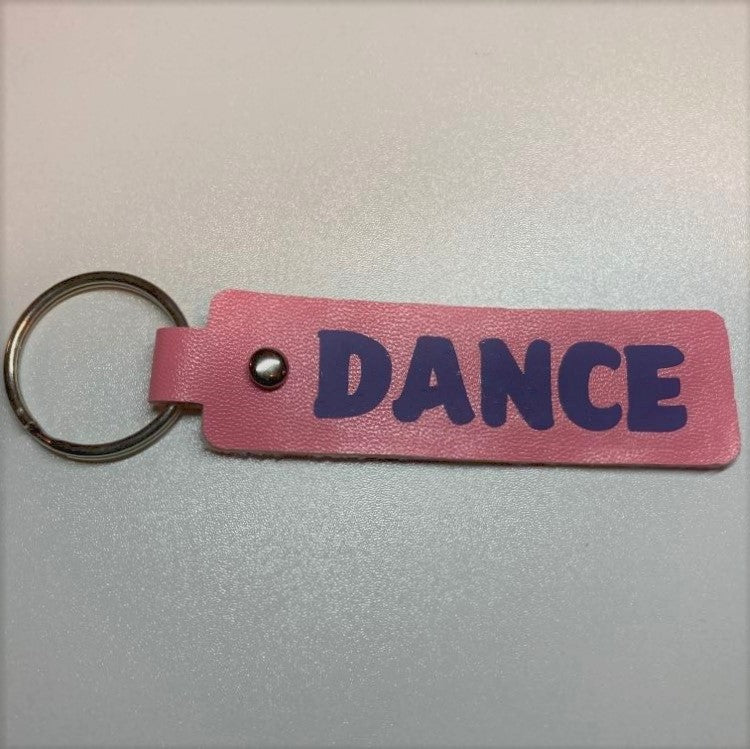 Faux Leather sports themed key fobs, dance pink/purple