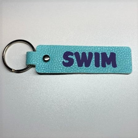 Faux Leather sports themed key fobs - swim blue/purple